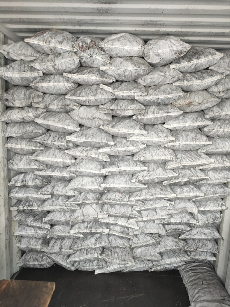 Sacks stacked inside a shipping container
